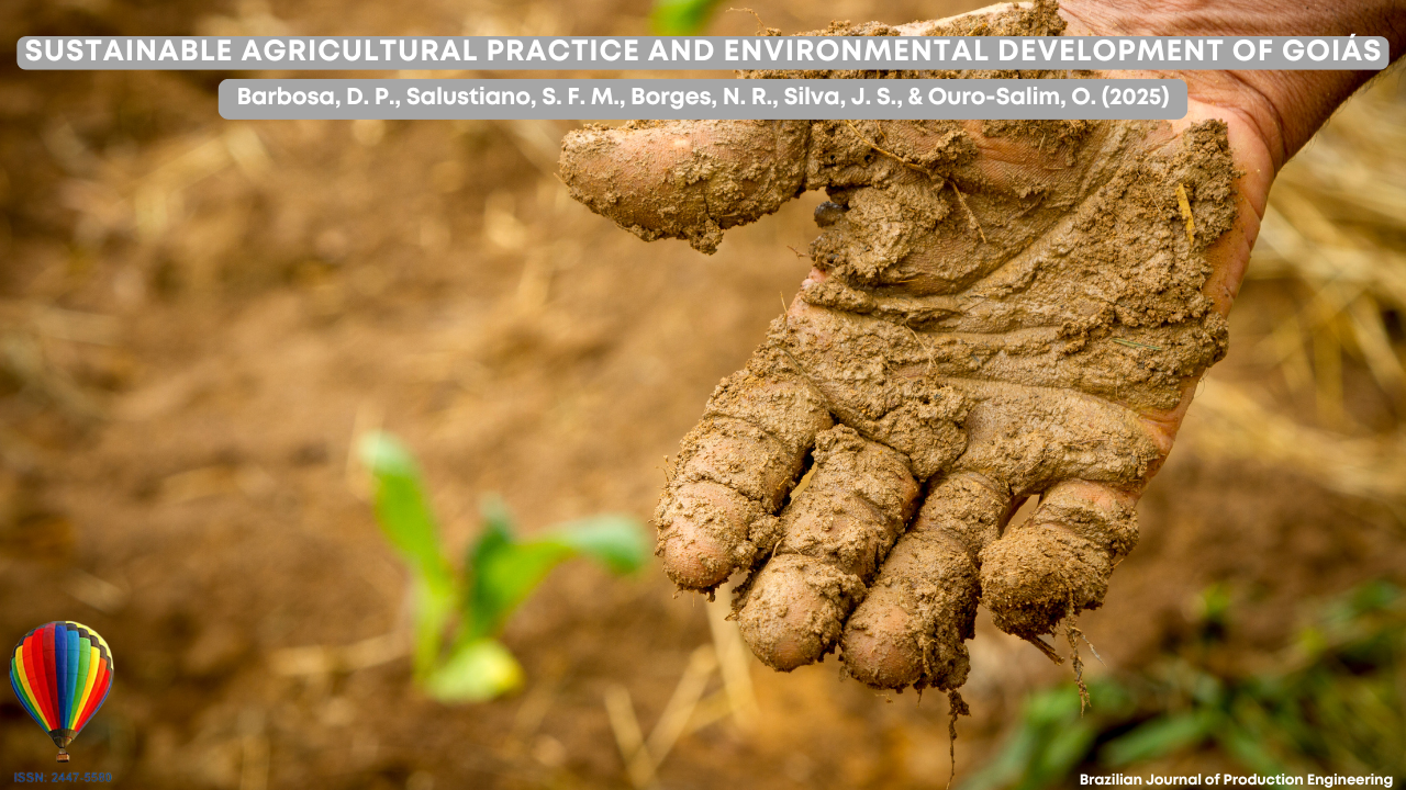 “A close-up of a hand covered in moist soil on a farm field, symbolizing sustainable agricultural practices.”